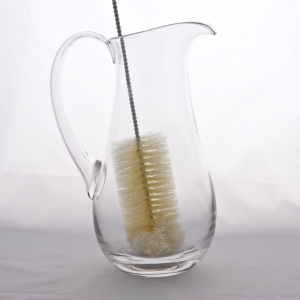 Glass brush with cotton tip in jug